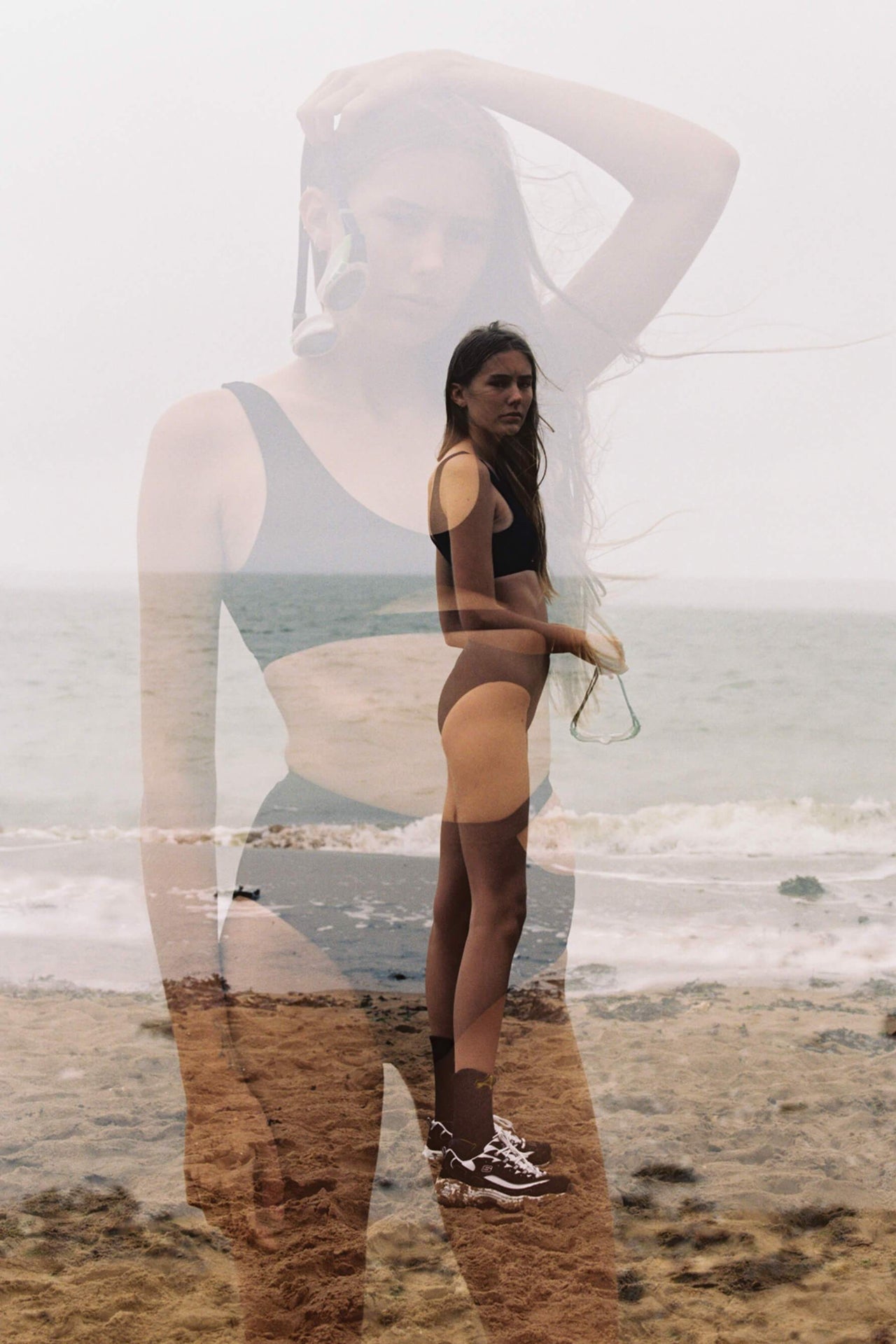 Marieyat Sade swim brief in black, high waisted with hip cut out. Double exposure photo showing side view and front on model.