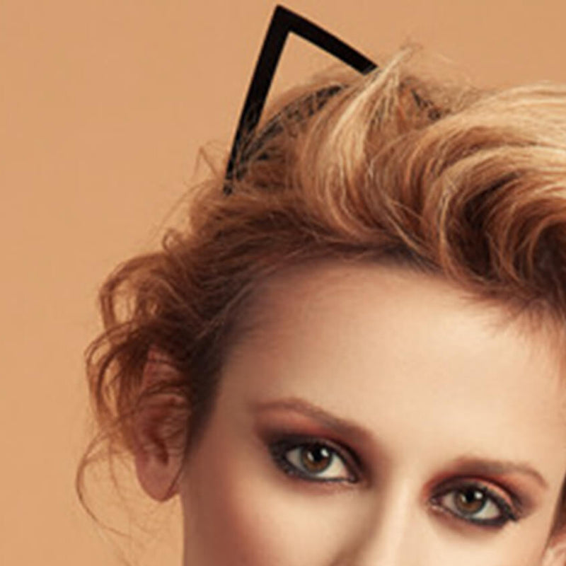 Close up of a blonde woman wearing kitten ear headband by Fraulein Kink