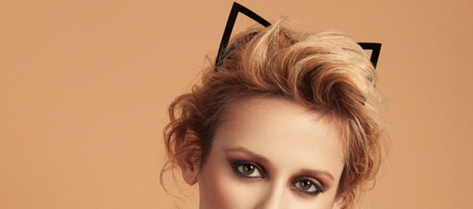 Close up of a blonde woman wearing kitten ear headband by Fraulein Kink