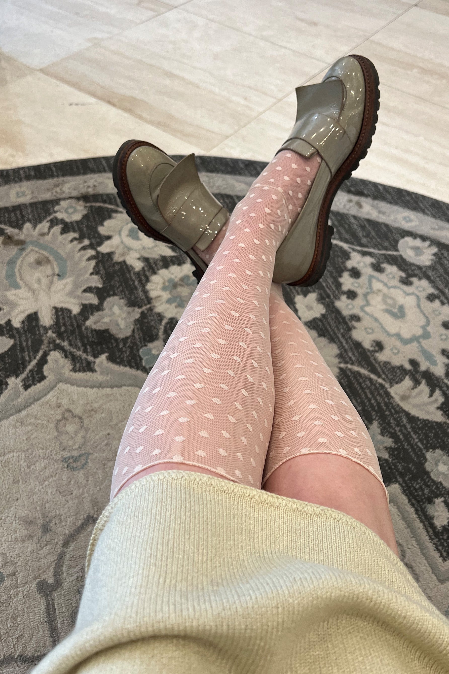 Only Hearts Coucou Lola ankle socks in light pink/beige tinted, front view shown on model. Image shows socks pulled up almost to the knee, the polka dot mesh, and rolled edge hem. 