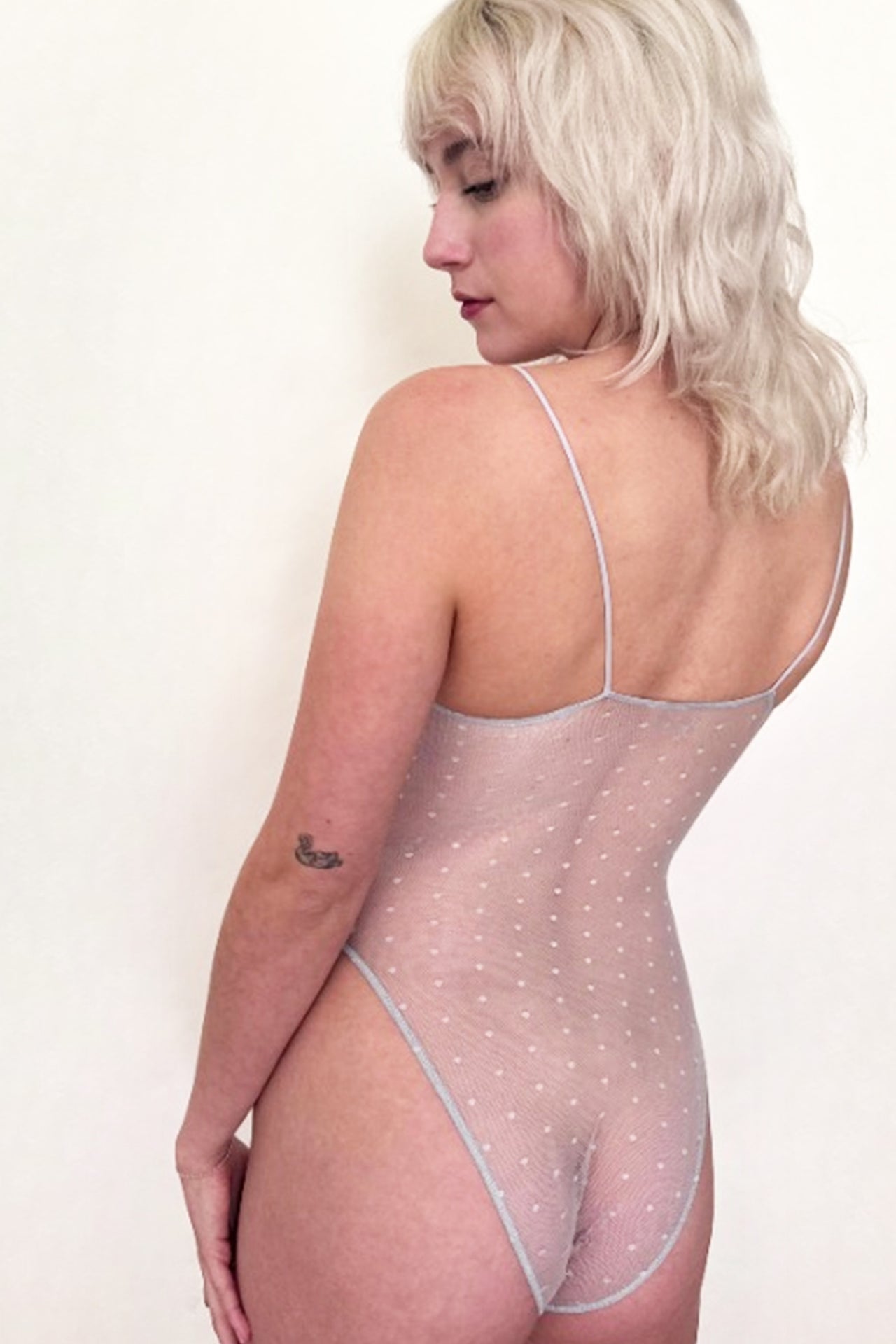 Only Hearts Coucou Lola Brigitte Bodysuit with tie front and Swiss dot mesh in icy crystal blue, front view on model.