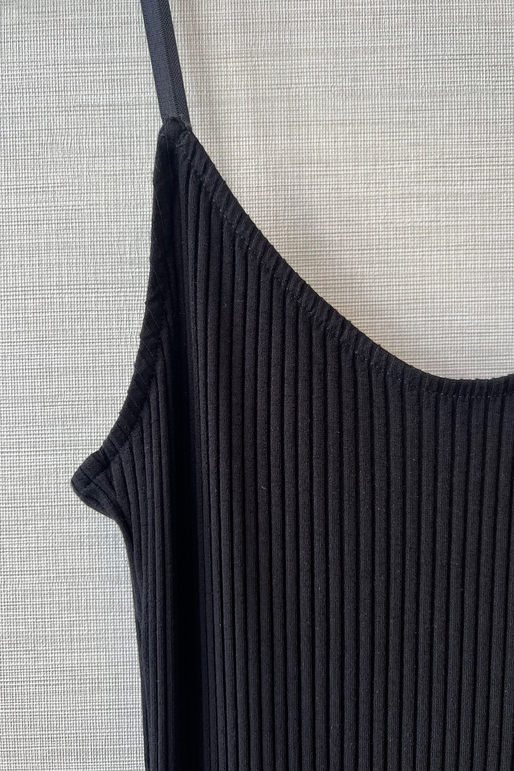 Close up of Only Hearts Eco Rib slip dress in black, showing the ribbed knit and elastic shoulder strap.