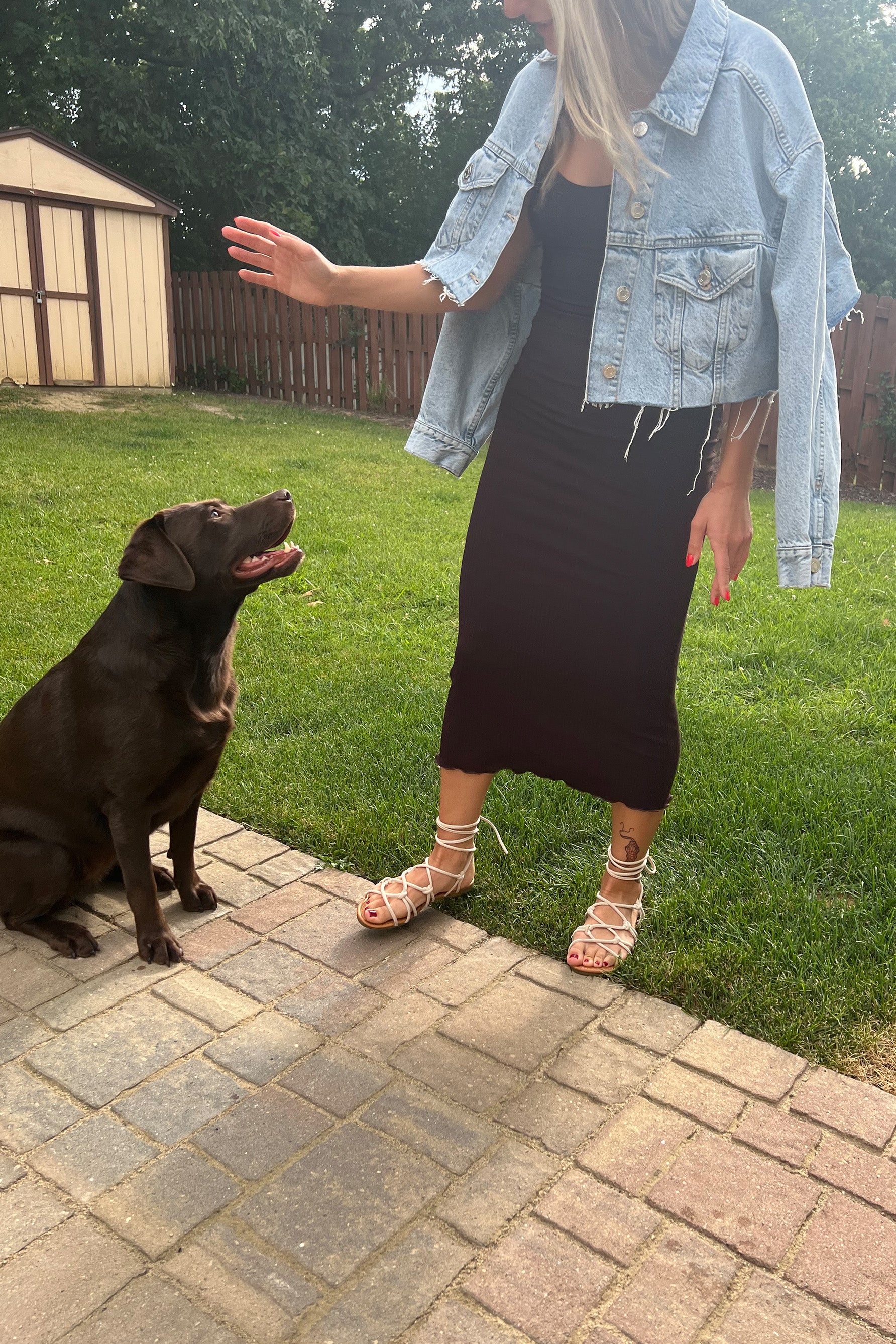 Only Hearts Eco Rib slip dress in dark brown caffeine, front view shown on model styled with light denim jacket. Image shows midi/maxi lettuce edge hemline, clingy silhouette, and scoop neck. 