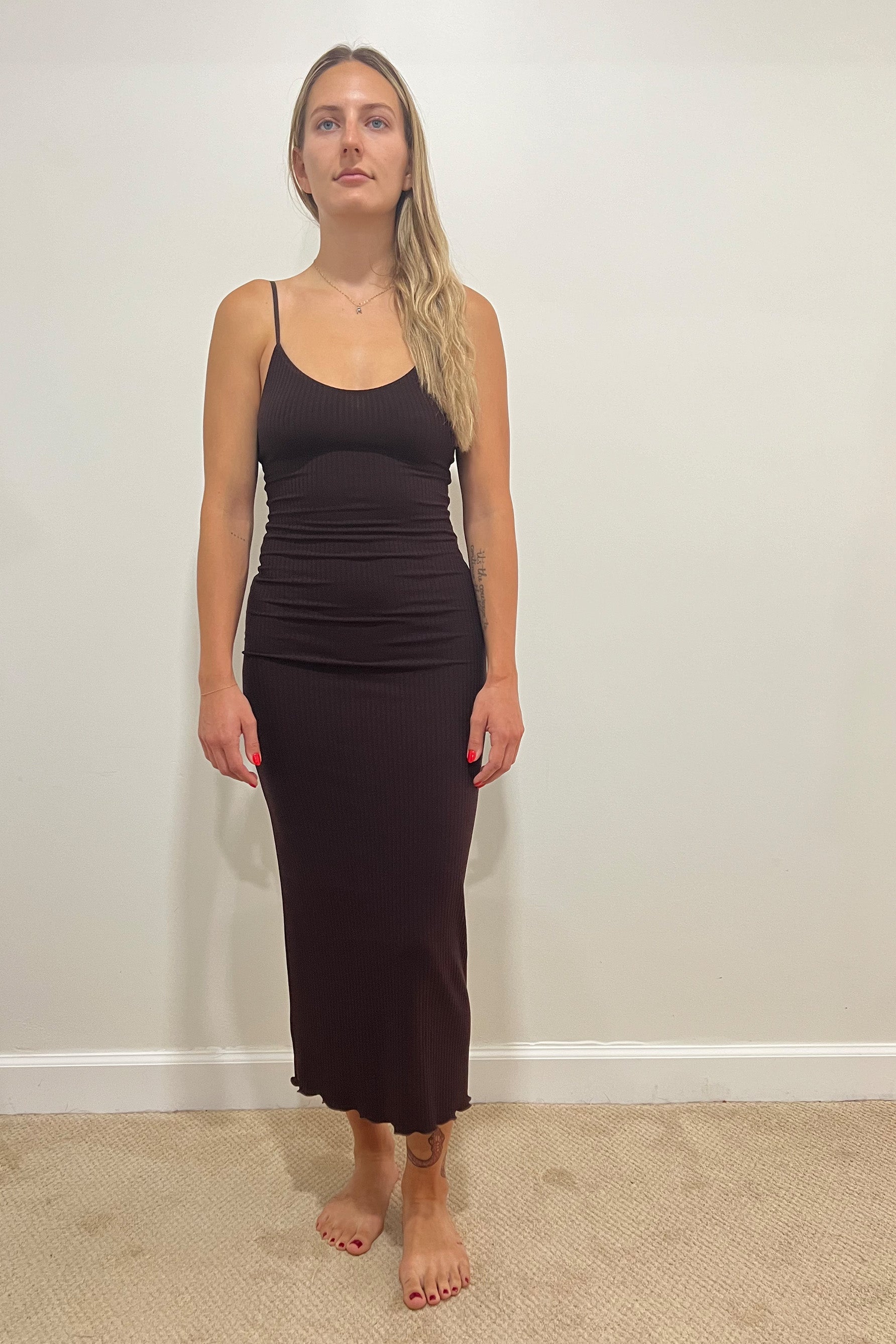 Only Hearts Eco Rib slip dress in dark brown caffeine, front view on model. Image shows spaghetti straps, scoop neckline, fitted silhouette, ribbed knit, and lettuce edge midi/maxi hemline. 