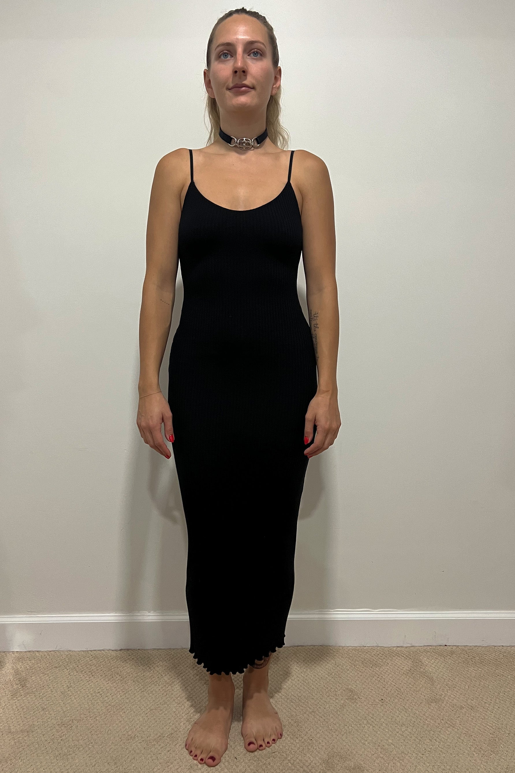 Only Hearts Eco Rib slip dress in black, front view on model. Image shows midi length lettuce edge hem, spaghetti straps, scoop neckline, and clingy silhouette. 