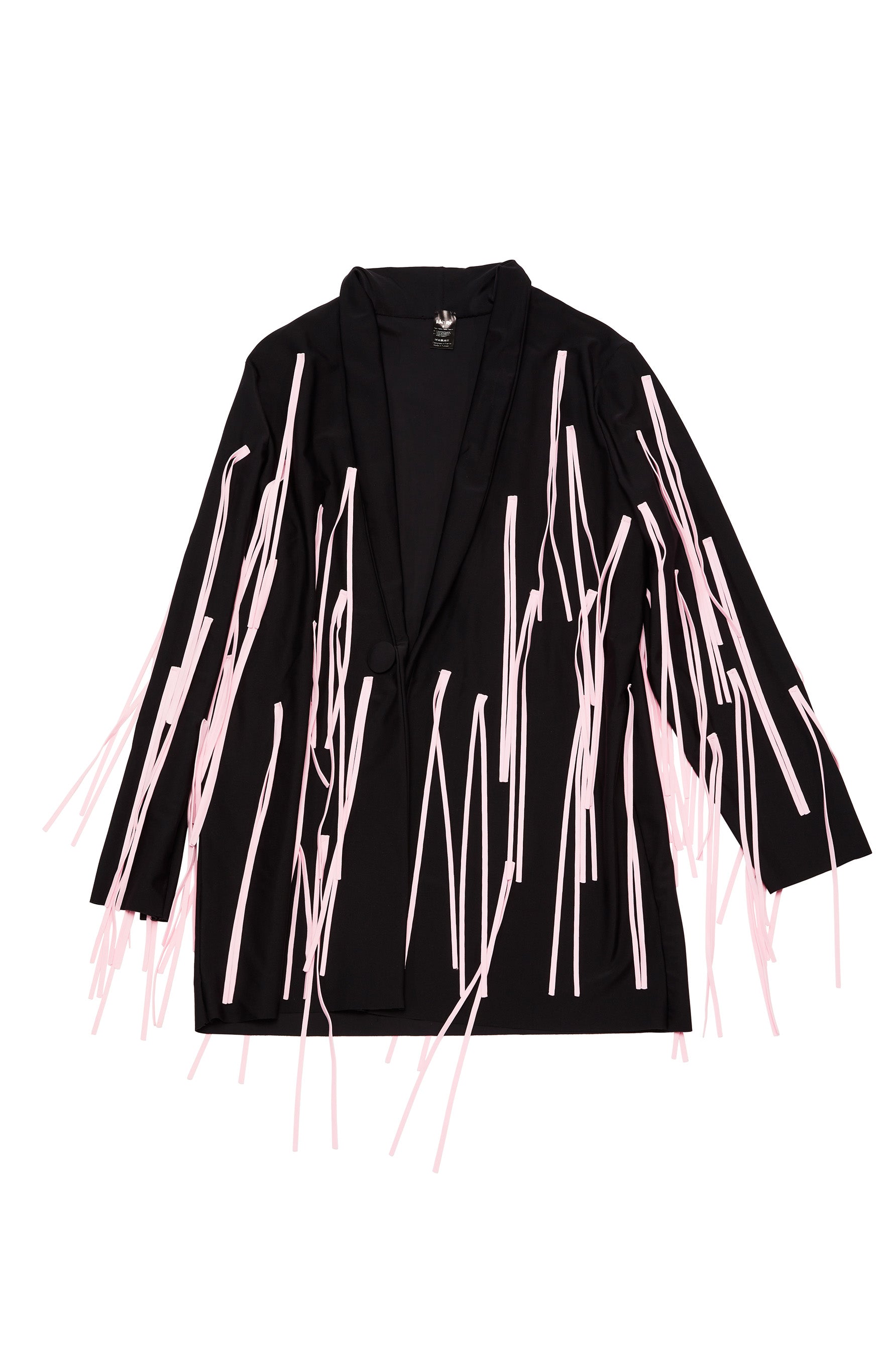 Ruban Noir black and pink fringe jacket, front view shown flat on white background. Shawl collar, long sleeve black jersey main fabric with light pink long fringes throughout. Image shows a button closure on one side but the actual jacket available for purchase has no closures.