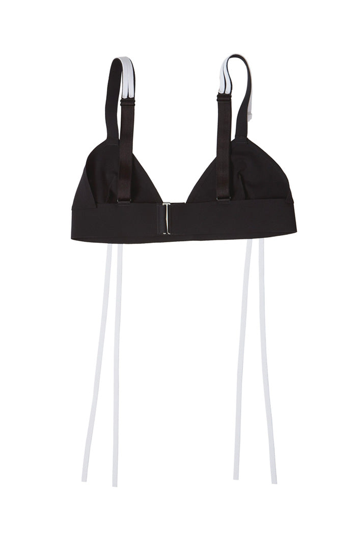 Ruban Noir triangle bralette/swim top with white fringe on front/shoulders. Shown flat on plain white background. Back view showing oversized swan hook closure at back.